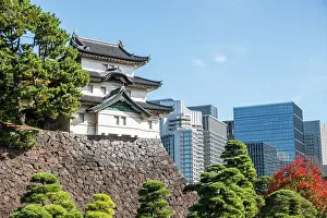 High Rises Prints: Fujimi-yagura guard tower in the Imperial Palace of Tokyo and modern skyscrapers in the background