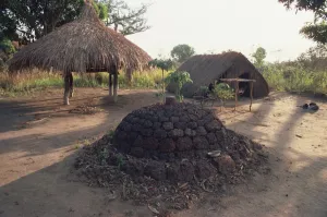 Sudan Prints: Funeral mound next to church in village near Maradi, Sudan, Africa