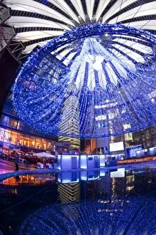 Futuristic design of the Sony Center in Potsdamer Platz, illuminated at Christmas