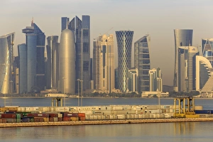 Commercialism Prints: Futuristic Doha city skyline and container port, Doha, Qatar, Middle East