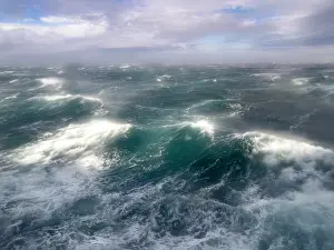 Strong Prints: Gale force winds impact National Geographic Resolution in Tanaga Bay in Alaska during rough sea conditions