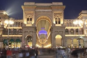 Galleria Vittorio Emanuele entrance illuminated at dusk, Milan, Lombardy, Italy, Europe