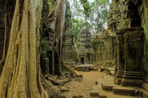 Ruined Gallery: Galleries and gopura entrance at 12th century temple Ta Prohm, a Tomb Raider film