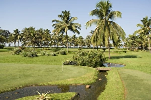 The garden and golf course at the Leela Hotel
