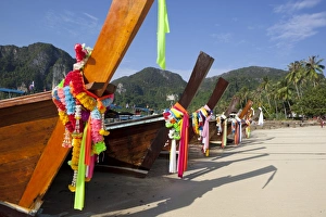 Garland Prints: Garlands decorating long-tail boats on beach