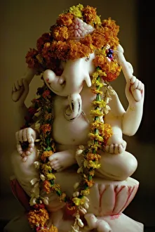 Hindu Prints: Garlands on statue of the Hindu God Ganesh