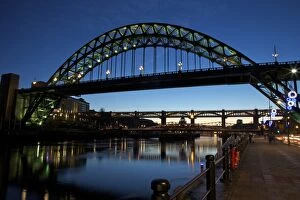 River Tyne Collection: Gateshead Quays with Tyne Bridge and River Tyne swing bridge at night, Tyne and Wear, England