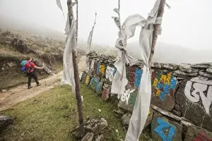 Images Dated 20th April 2010: Gateway to Nepal with flags and Buddhist inscriptions near the village of Tumling