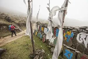 Symbolism Prints: Gateway to Nepal with flags and Buddhist inscriptions near the village of Tumling