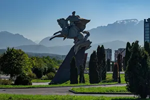 Honor Prints: General Pliyev monument stands in Vladikavkaz with mountains in the background and greenery surrounding the area