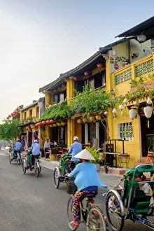Medium Group Of People Prints: General view of shop houses and bicycles in Hoi An, Vietnam, Indochina, Southeast Asia