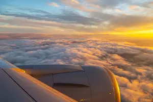 Aeroplane Prints: Generic view from airplane window of airplane wing and sunrise over England, United