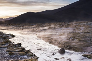 Geothermal Gallery: Geothermal river at sunrise at Chalviri Salt Flats (Salar de Chalviri), Altiplano of Bolivia
