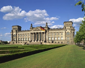 The German flag flies in front of the Reichstag in Berlin