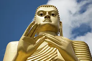 Radiant Prints: Giant Golden Buddha statue at Dambulla cave temple complex