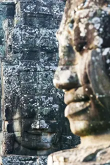 Focus On Background Prints: Giant heads at the Bayon temple, UNESCO World Heritage Site, Angkor, Siem Reap, Cambodia