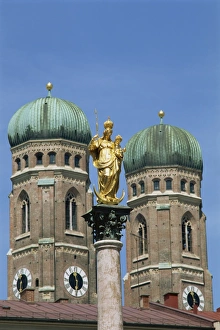 Frauenkirche Prints: Gilded statue in the Marienplatz and towers of