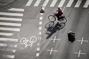 Girl on bicycle at crossroads, Copenhagen, Denmark, Scandinavia, Europe