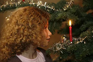 Christmas Tree Prints: Girl looking at Christmas tree, Haute Savoie, France, Europe