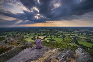 Cheshire Collection: A girl looks out over the Cheshire Plain from Bosley Cloud, Cheshire, England, United Kingdom