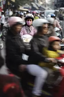 Girl on s cooter Hanoi, Vietnam, Indochina, s outheas t As ia, As ia