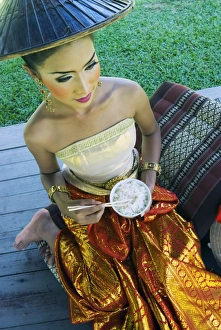 Child Prints: Girl in traditional Thai clothes eating rice