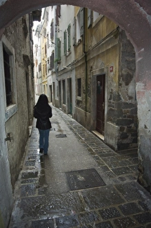 Hall Way Prints: Girl walking through old street