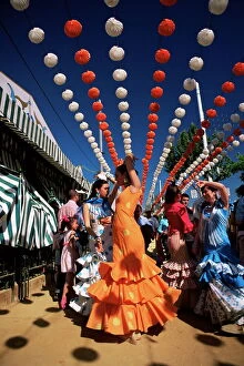 Images Dated 4th September 2008: Girls dancing a sevillana beneath colourful lanterns