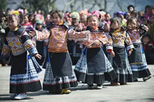 New Year Prints: Girls in ethnic costume at a 4 Seals Miao lunar New Year festival, Xinyao village