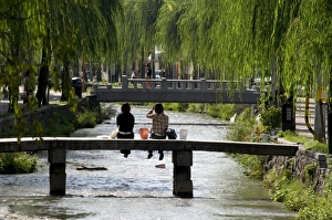 Tee Nager Prints: Two girls sitting on bridge