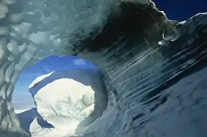Ice Bergs Prints: Glacial meltwater tunnel in iceberg showing sculpted water flow patterns