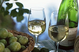 Loire Prints: Glasses of white wine on table with river relected in glass, Loire, France, Europe