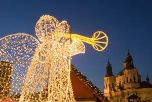 Angel Prints: Glowing angel, part of Christmas decoration at Staromestske (Old Town Square) with Baroque St