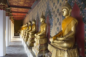 Wat Arun Prints: Gold Buddha statues in Wat Arun (The Temple of Dawn)
