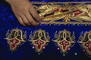 Embroidery Prints: Detail of gold embroidery work in embroidery factory, Bukhara, Uzbekistan