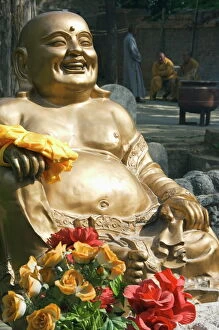 A golden Buddha statue at Shaolin Temple, birthplace of Kung Fu martial arts