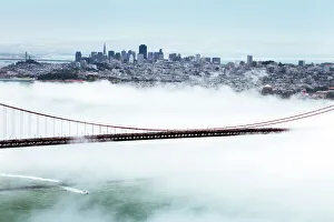 Foggy Gallery: Golden Gate Bridge and the San Francisco skyline floating above the fog on a foggy day in San