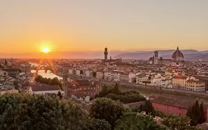 Glowing Gallery: Golden rays over the Ponte Vecchio and Duomo as the sun sets over Florence, UNESCO