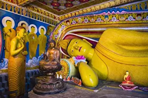 Golden reclining Buddha at Temple of the Tooth (Temple of the Sacred Tooth Relic) in Kandy, UNESCO World Heritage Site, Sri Lanka, Asia