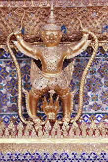 Naga Prints: Golden sculpture of Garuda and Naga