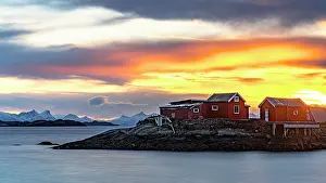 Svolvaer Prints: Golden sunrise over rorbu cabins by the water in Lofoten Islands, Norway