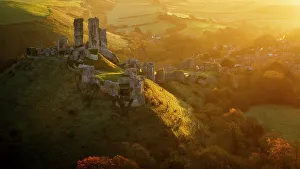 Corfe Prints: Golden sunrise over the village and castle at Corfe, Dorset, England, United Kingdom