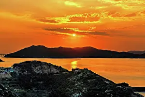 Warmth Prints: Golden sunset over the hills and the sea