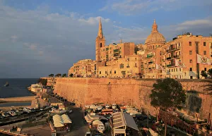 Watercraft Prints: Golden warm evening light on buildings and churches