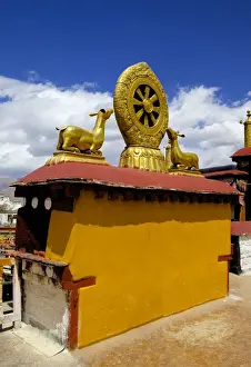 Gilded Prints: Golden Wheel of Dharma and deer sculptures on the sacred Jokhang Temple roof