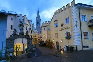 The Goldener Adler Hotel and the bell tower of Cathedral of Brixen (Bressanone)