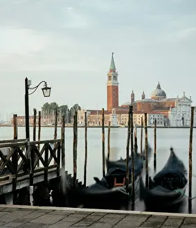 Romance Prints: Goldolas on the lagoon at dawn with a view of San Giorgio Maggiore in the background near San Marco in Venice