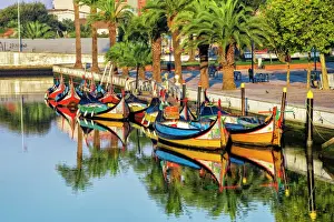 Painted Prints: Gondola-like moliceiros boats anchored along the Central Channel