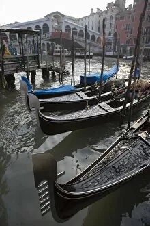 Images Dated 26th July 2005: Gondolas moored on Grand Canal near Rialto Bridge, Venice, UNESCO World Heritage Site