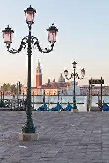 Gondolas moored on the Lagoon, San Giorgio Maggiore beyond, Riva degli Schiavoni